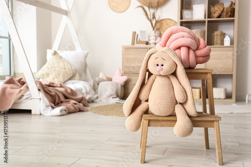 Toy bunny with pillow on st...