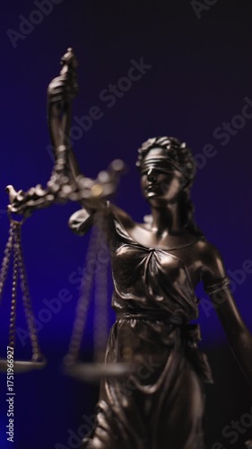 police lights on behind the international blindfolded statue of law holding a balance represented by justice and law 