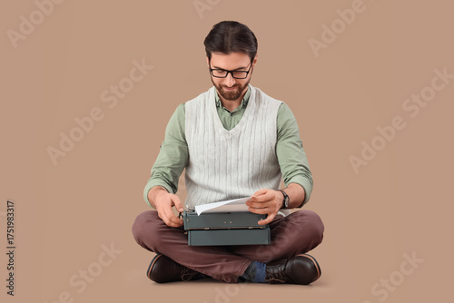 Young happy male writer wit...