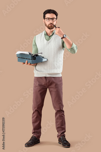 Young male writer with vint...