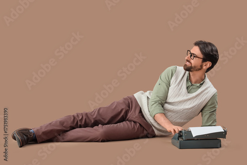 Young happy male writer wit...