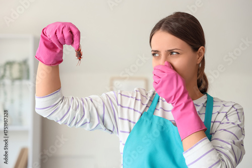 Displeased female janitor w...