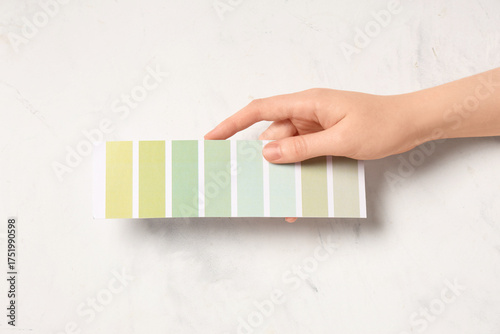 Female hand with color pale...