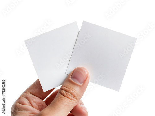 Hand Holding Two Blank White Square Cards Against a Black Background for Creative Design and Presentation Mockups