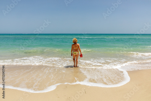 Wallpaper Mural attractive senior woman at the beautiful sandy beach in bikini Torontodigital.ca