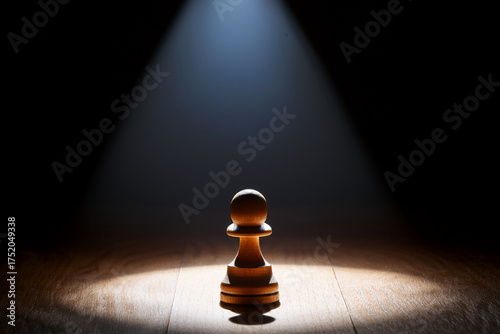 A lone pawn in dramatic light, symbolizing the journey from self-doubt to personal empowerment.
