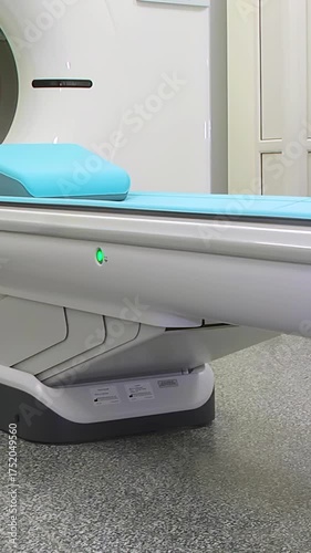 Computed axial tomography (CAT). CT scanner. Medical examination using a modern CT scanner in a modern hospital - Vertical video.