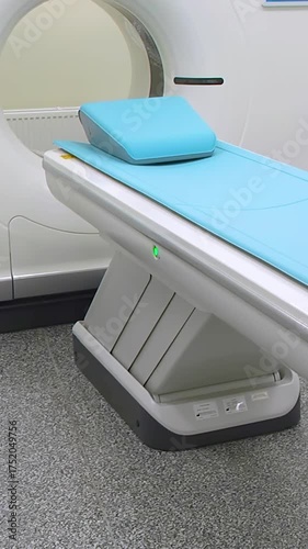 Computed axial tomography (CAT). CT scanner. Medical examination using a modern CT scanner in a modern hospital - Vertical video.