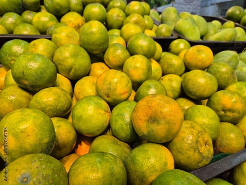 Close Up of fresh oranges arranged in a mart