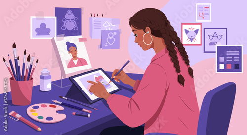 Young female artist drawing on a digital tablet with stylus in her creative workspace full of art supplies, concept for digital art, illustration and graphic design