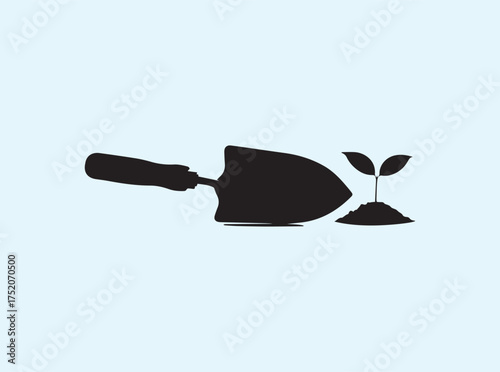 Hand Trowel with Seedling Silhouette Isolated on White Background Representing Tree Planting
