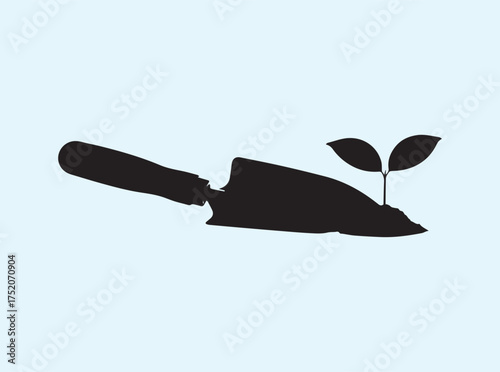 Environmental Care Symbol Trowel with Leaf Silhouette Isolated on White Background
