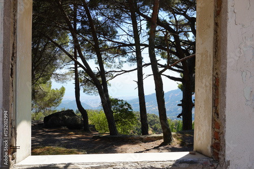 Fotografi Scenic Mediterranean Panorama from Rustic Window Frame