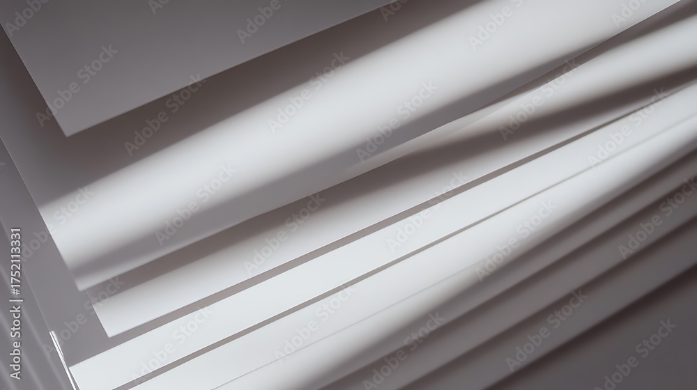 Obraz premium Abstract layered white sheets, captured in a geometric composition. A play of light and shadows accentuates the minimalistic design. #abstractart