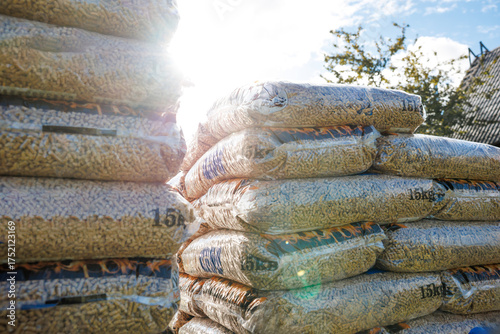 Cuadro en lienzo 15kg bags of wood pellets arranged outdoors with transparent packaging