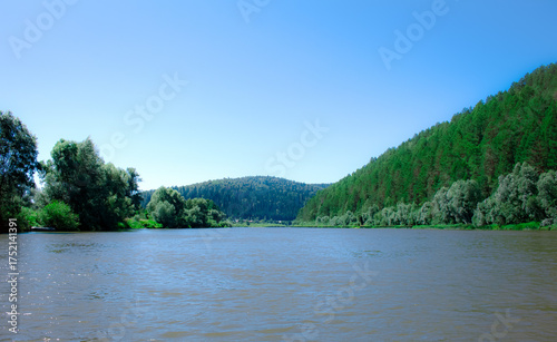 photo of the Ural River. hills and trees around