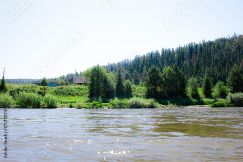 photo of the Ural River. hills and trees around