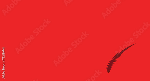 A single expressive dark brushstroke on a red surface.