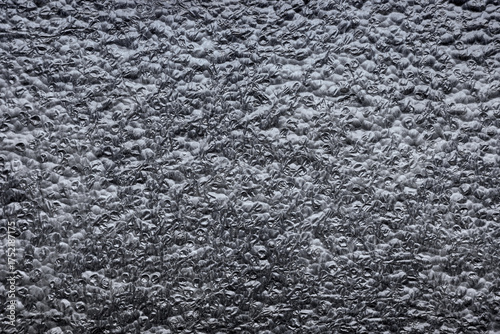 Closeup photo of closed cell polyethylene foam surface, abstract background.
