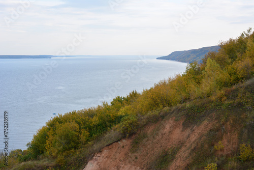 Wallpaper Mural Autumn River Landscape with Eroding Cliff and Yellow Trees Torontodigital.ca