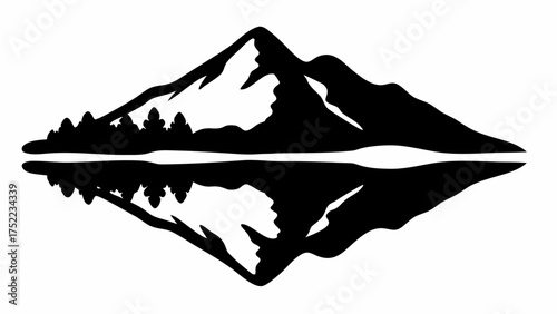 Silhouette of mountains and trees reflected in water creating a symmetrical design in black and white style