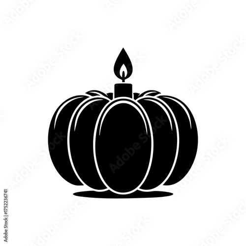 Pumpkin-shaped candle glowing warmly, merging autumn charm with Halloween coziness.
