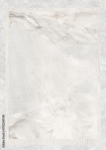 Close-up of white marble surface with subtle gray veining and textured border