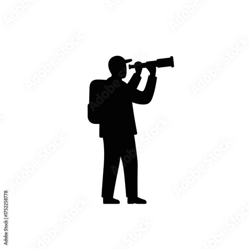 Man using a telescope while standing in silhouette, concept of International Men's Day  