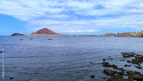 View of Montana Roja volcano and Atlantic Ocean from El Medano, Tenerife, Canary Islands, Spain