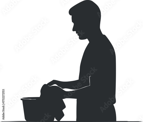 Silhouette of a man engaging in laundry tasks with a bucket and towel.