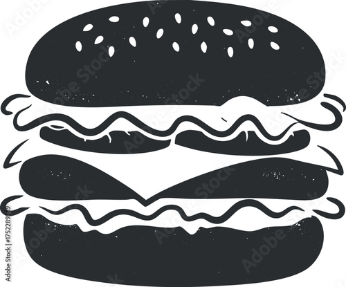A delicious and classic hamburger with layers of toppings and sesame seed bun.
