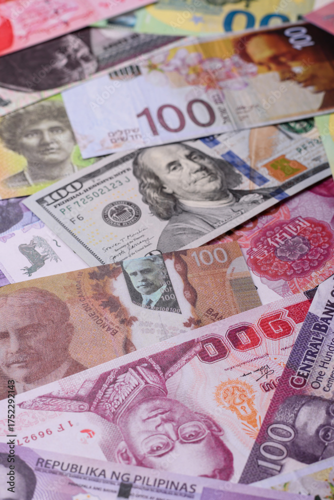 Obraz premium Paper money, banknotes of different countries as a business background. Paper money and cash