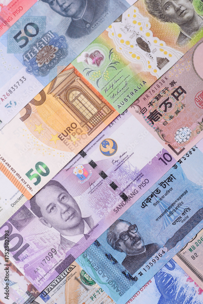 Obraz premium Paper money, banknotes of different countries as a business background. Paper money and cash