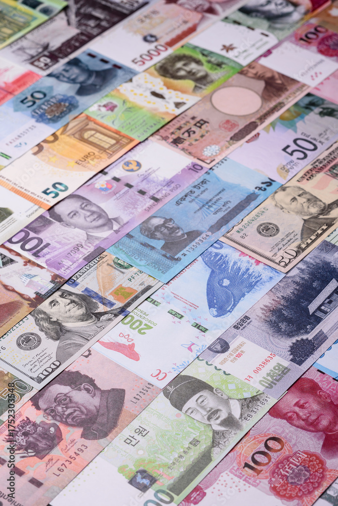 Obraz premium Paper money, banknotes of different countries as a business background. Paper money and cash