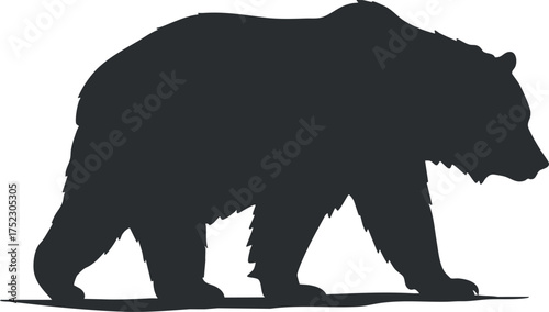 A silhouette of a bear walking, representing wildlife and nature in its natural habitat.