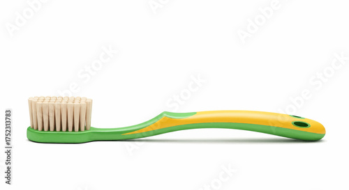 Green plastic toothbrush with yellow accents for dental hygiene, isolated on a white background, vector illustration