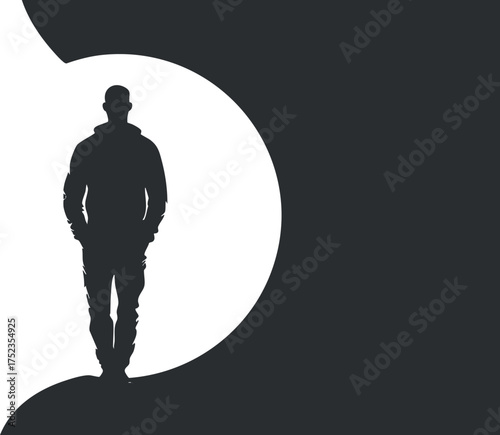 Silhouette of a man walking against a contrasting black and white background, creating a mysterious ambiance.