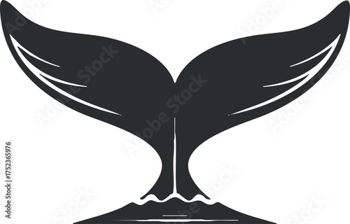 Black silhouette of a whale tail in the ocean, symbolizing marine wildlife and nature.