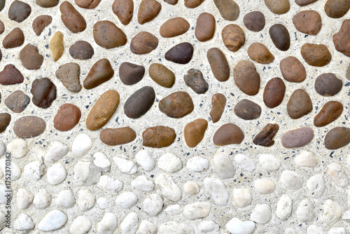 pattern of brown and white pebble stone walkway, decorative stone floor