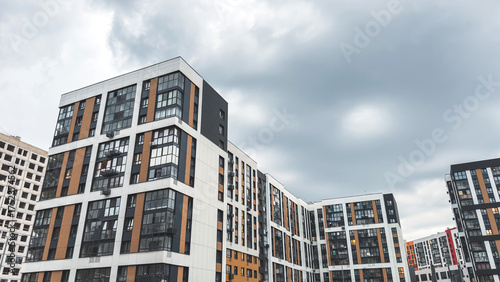 Canvas Print Modern residential complex with stylish glass and panel facades in white, black
