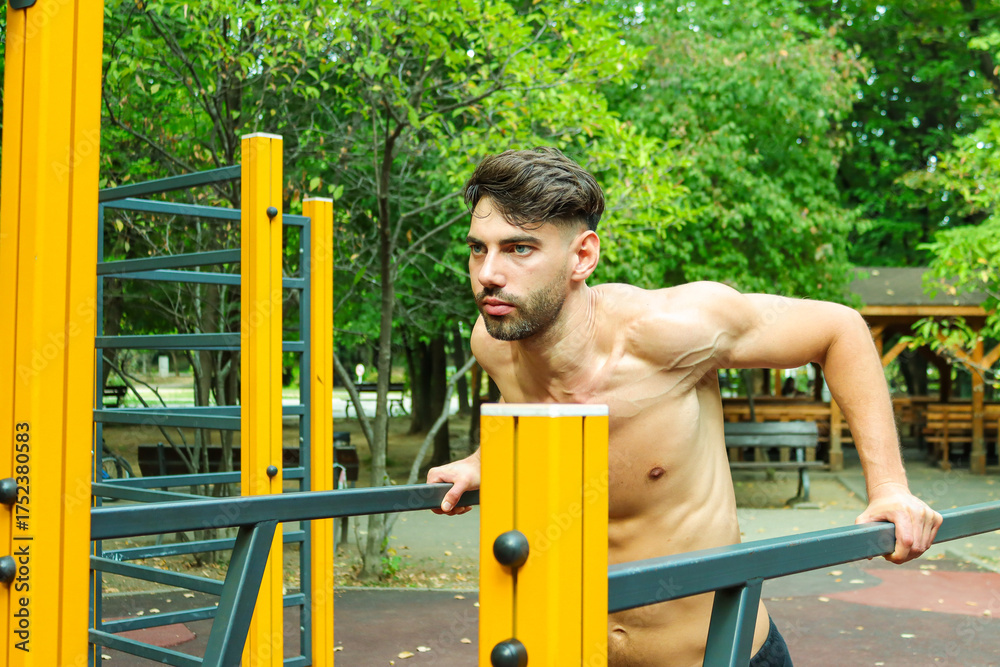 Fototapeta premium Man working out in Calisthenics Park