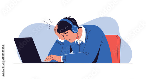 Frustrated young man with headphones working on a laptop looking stressed and exhausted.