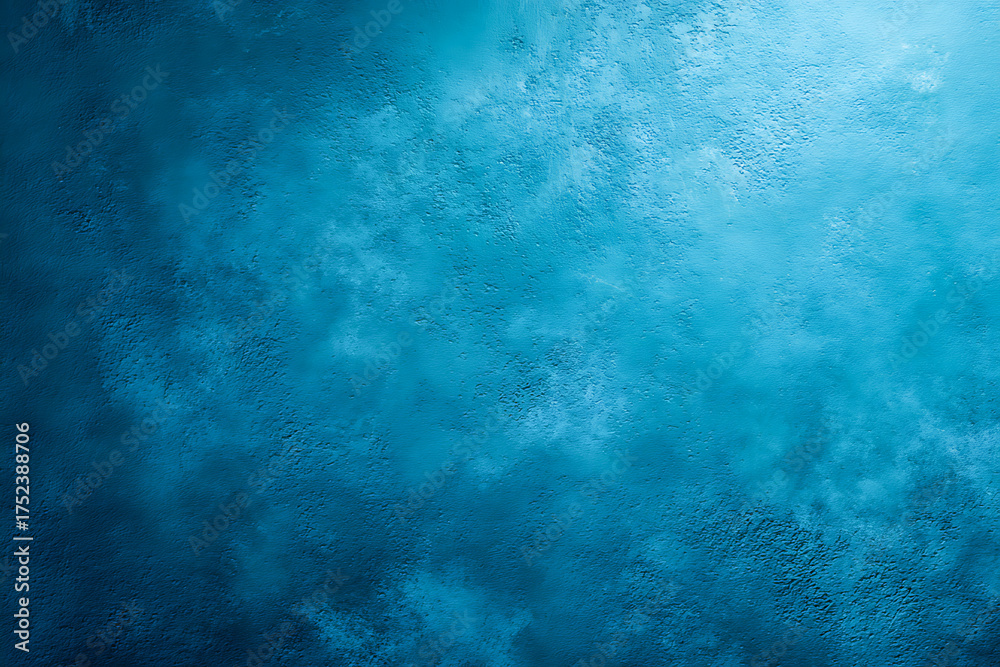 Fototapeta premium Rich blue textured surface with soft tonal variations ranging from deep cobalt to light turquoise, creating a sense of depth and smooth diffusion of light.