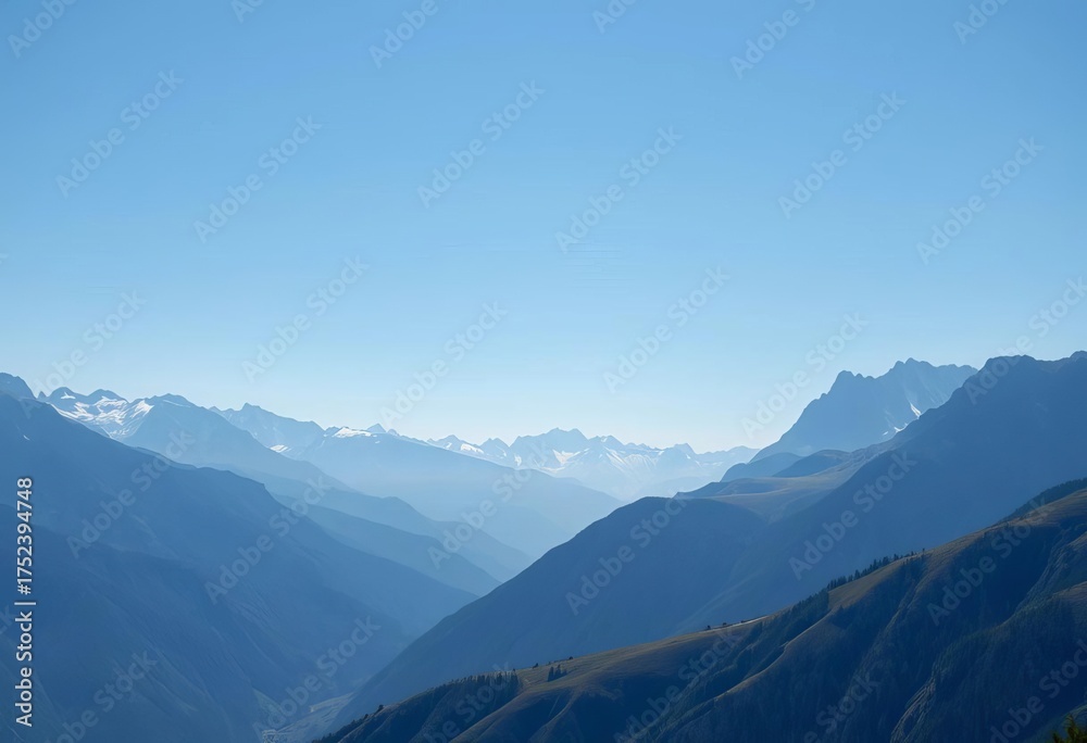 Naklejka premium Expansive vista of pristine mountain range, clear blue sky, unobstructed, high