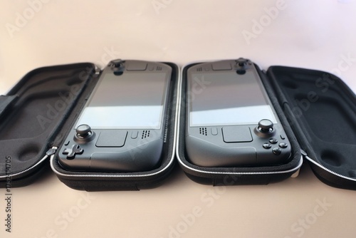 Tableau sur toile Portable game consoles in protective cases — the concept of mobile gaming, trave