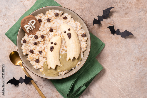 A bowl of food with bananas and ghostly faces on it