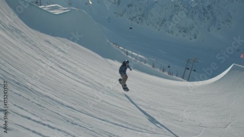 A professional snowboarder performs a daring stunt on a half pipe, captured in a cinematic shot that highlights dynamic motion, skill, adrenaline, and the thrill of winter extreme sports