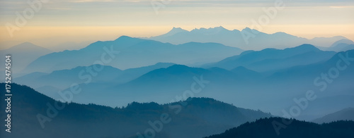 Amazing wild nature view of layer of mountain forest landscape with cloudy sky. Natural green scenery of cloud and mountain slopes background. Maehongson,Thailand. Panorama view