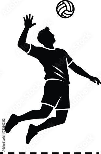Silhouette of a volleyball player spiking the ball in mid air