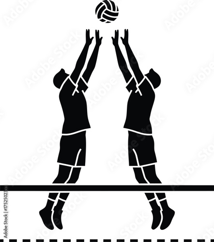 Volleyball players jumping to block a spike